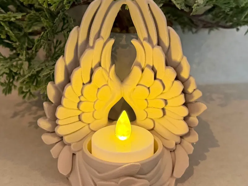 Soporte para velas con alas de ángel
