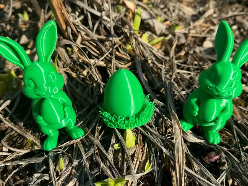 Easter bunnies and egg in the grass