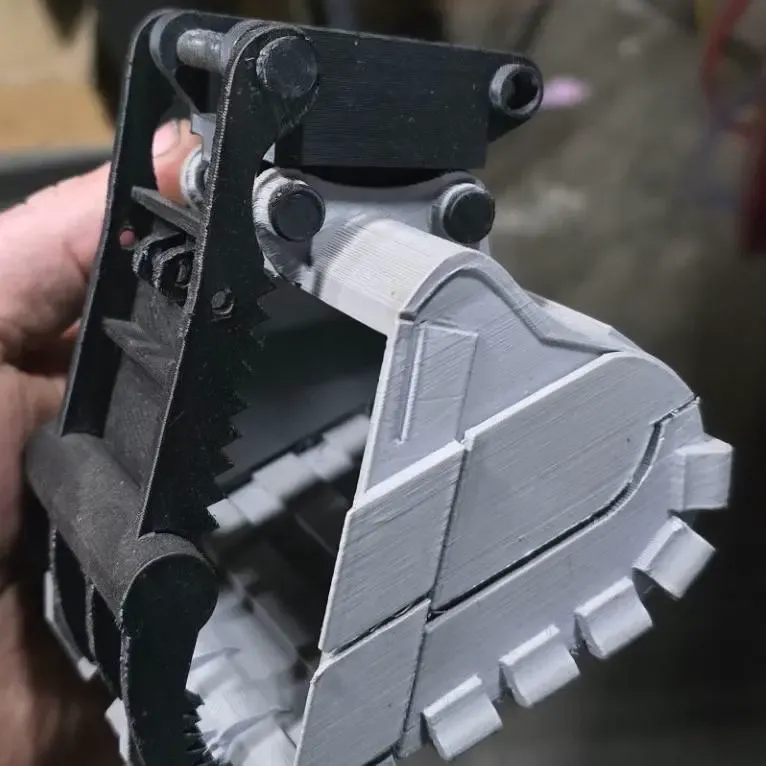 coupler and thumb for bucket phone holder