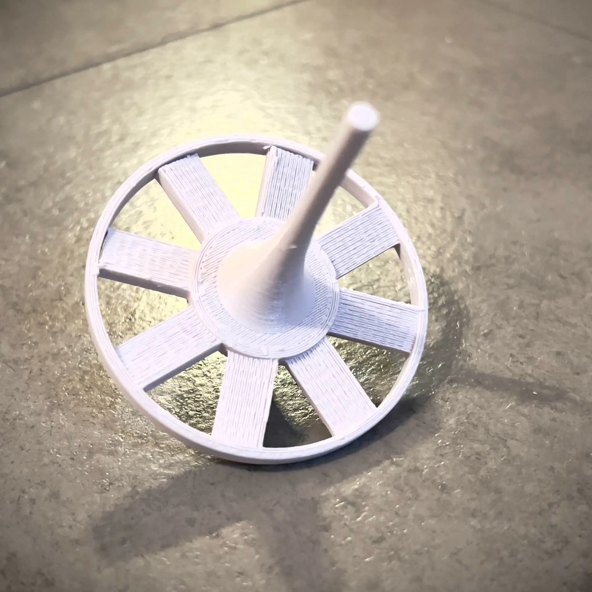 The Fan Spinning Top: Industrial Physics on Your Desk