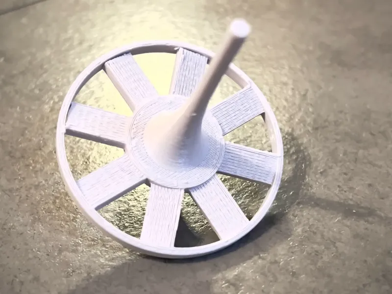 The Fan Spinning Top: Industrial Physics on Your Desk