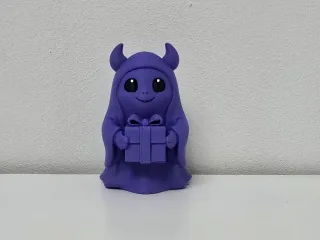 Horned Ghost with Gift Christmas Figurine