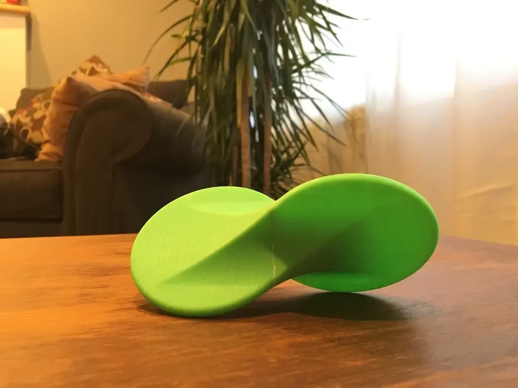 Oloid Wobbler (rolling fidget desk toy)