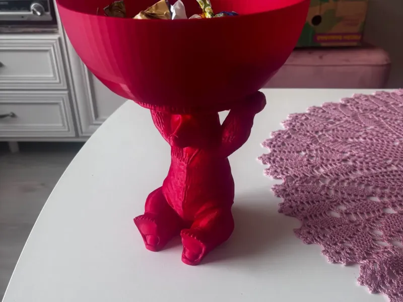 Bear holding a snack bowl