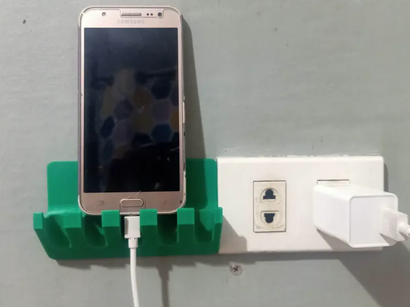 Wall mounted phone holder and power plug hanger
