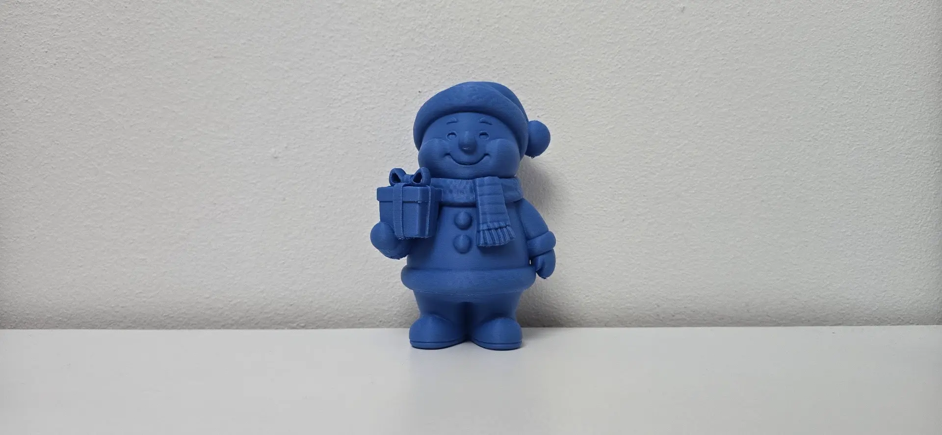 Chubby Smiling Snowman with Gift Christmas Figurine