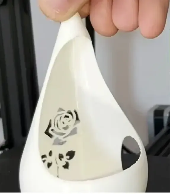 theelight holder with rose design