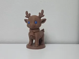 Reindeer with Blue Eyes and Bell Christmas Figure