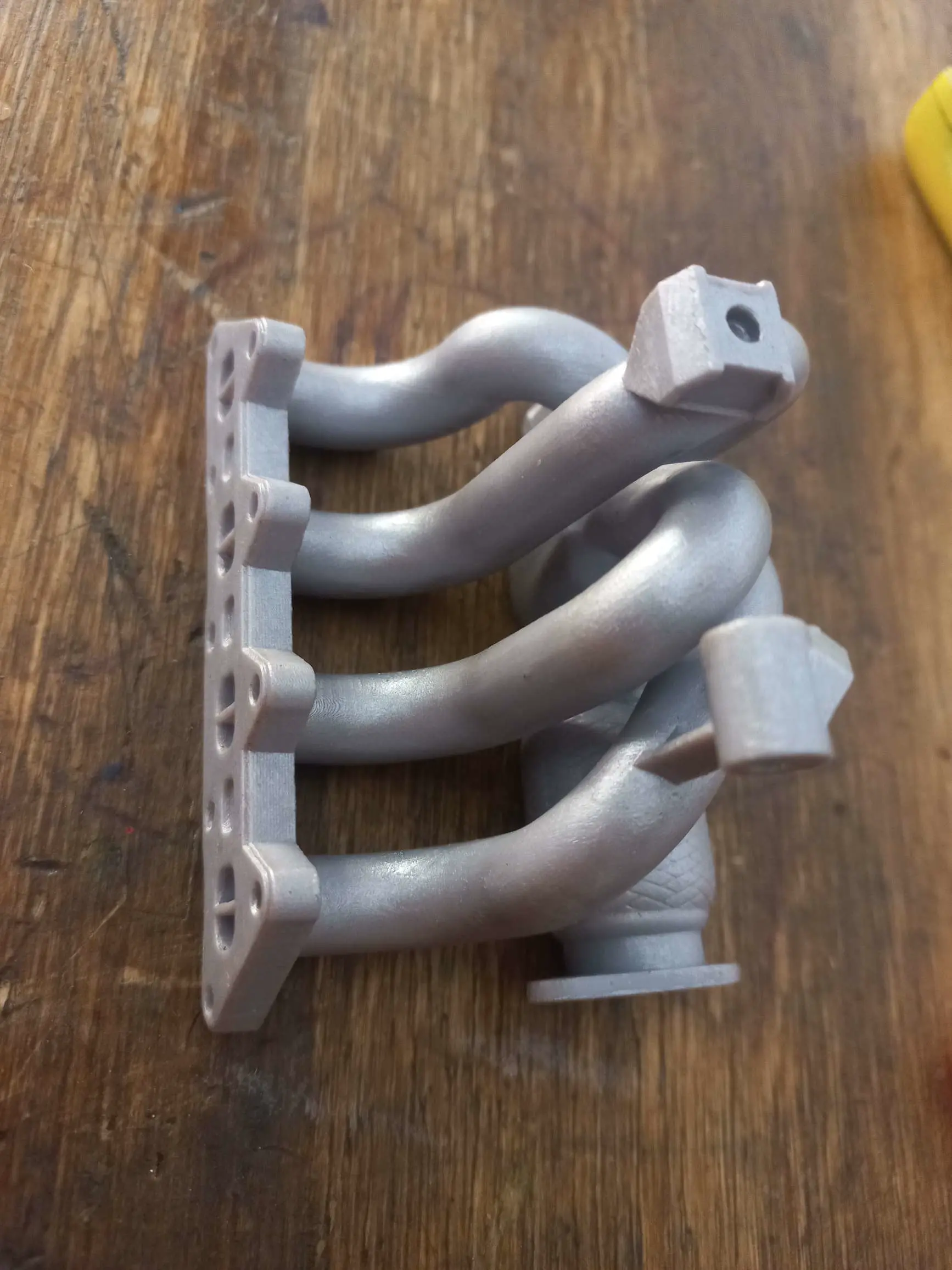 Phone stand- exhaust manifold