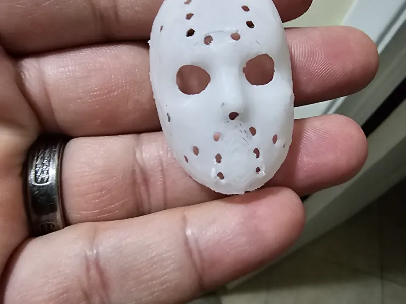 Jason mask with Jason name on the side right cheek.