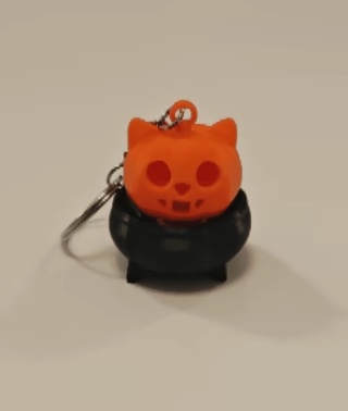 Kattenkop halloweenpompoen in ketel - fidgetclicker