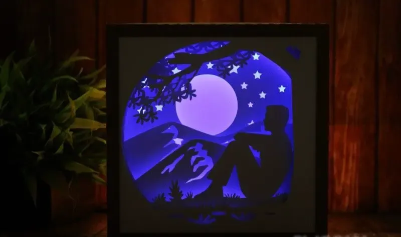 Boîte à lumière Homme assis seul (boîte d'ombre)
