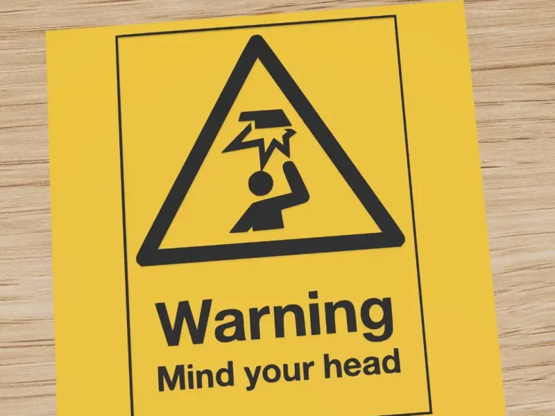 Warning sign: mind your head overhead hazard