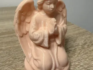 Kneeling praying angel