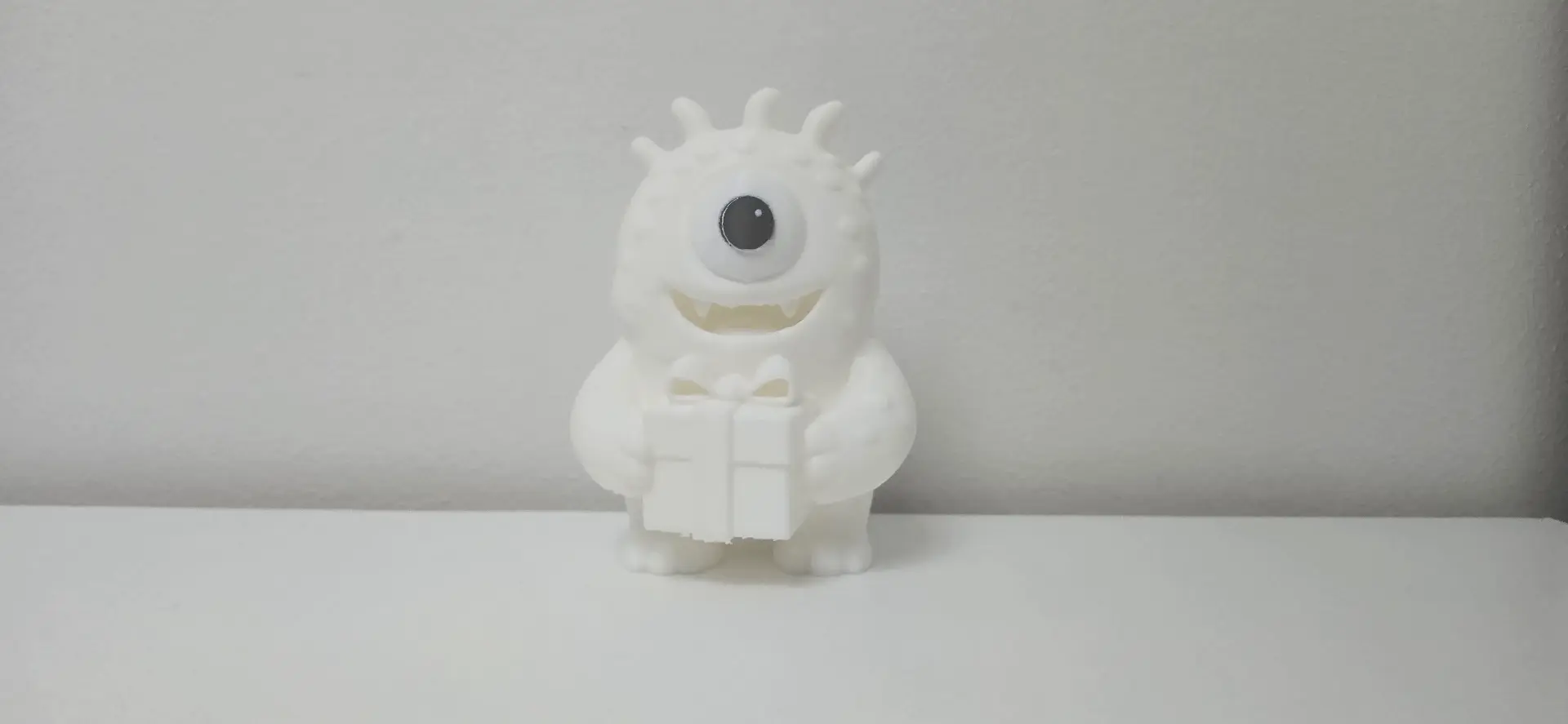 One-Eyed Monster with Gift Christmas Figure