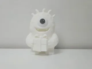 One-Eyed Monster with Gift Christmas Figure