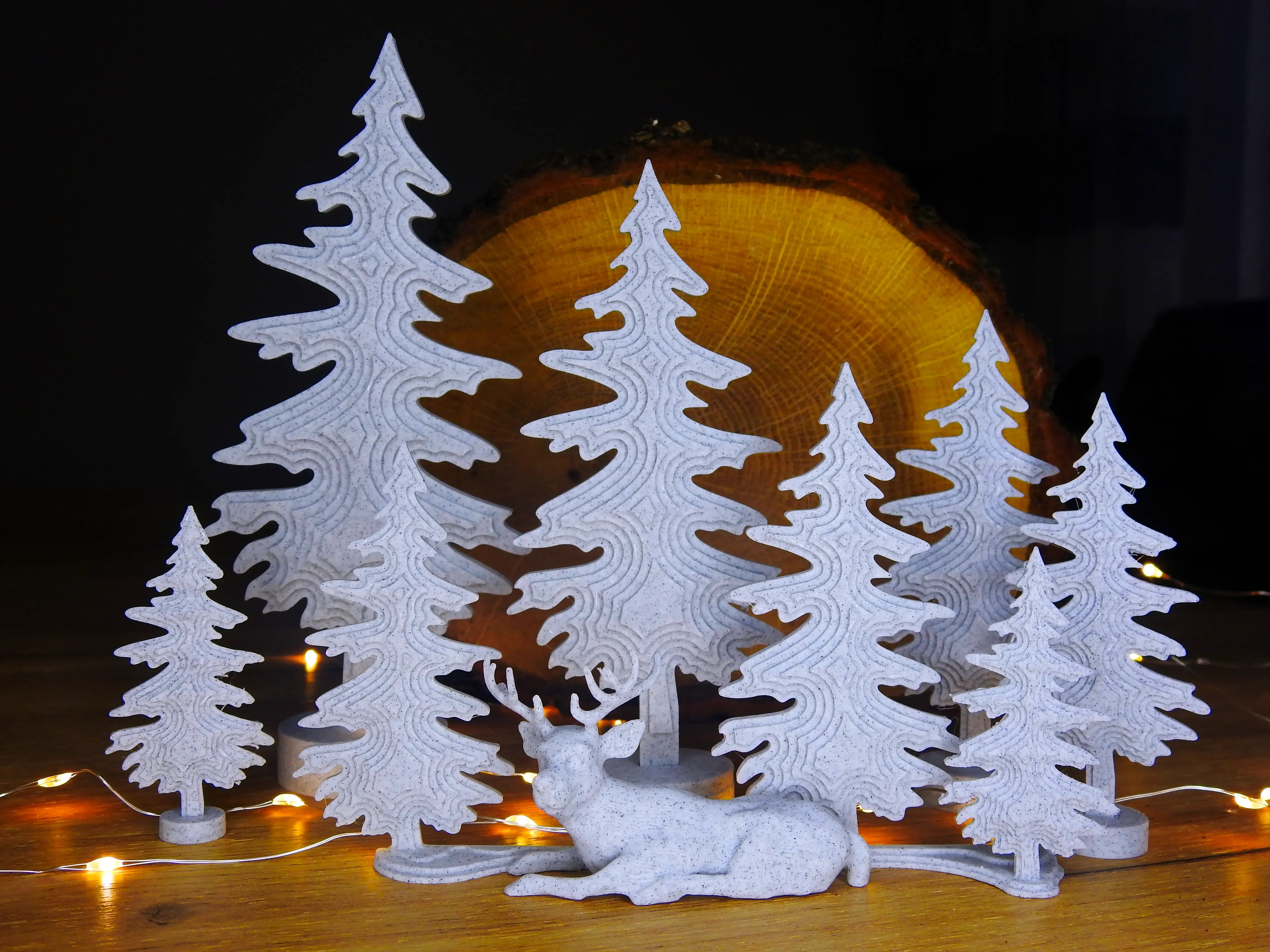 Sleepy deer with trees