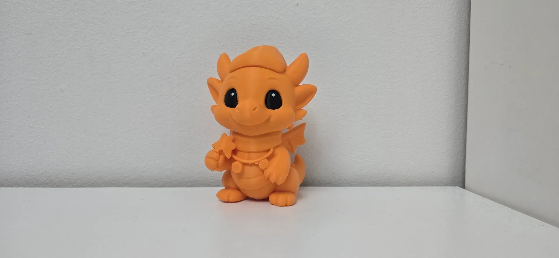 Dragon with Star and Holiday Chain Figurine