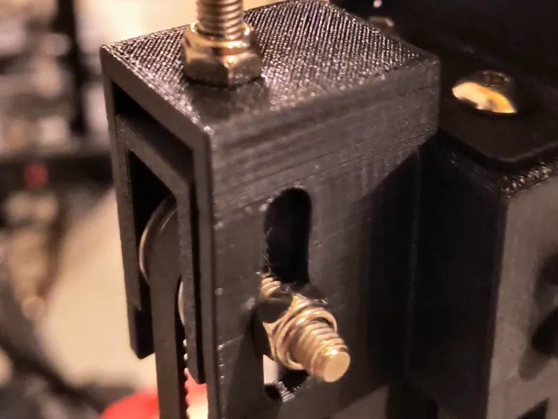 Belted z tensioner