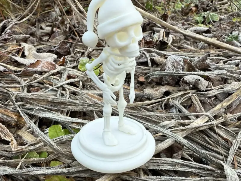 Christmas Skeleton in a hat on a pedestal