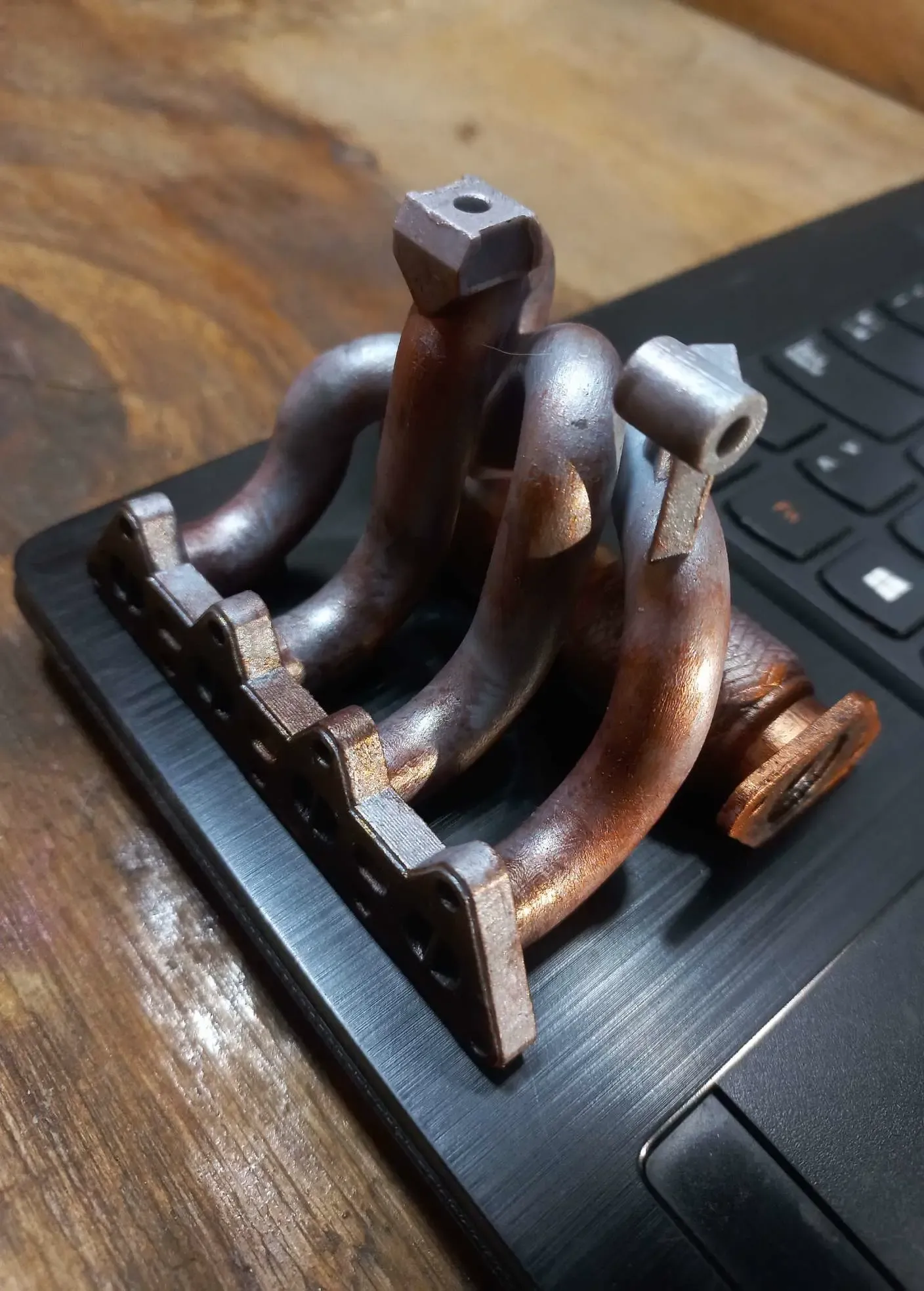 Phone stand- exhaust manifold