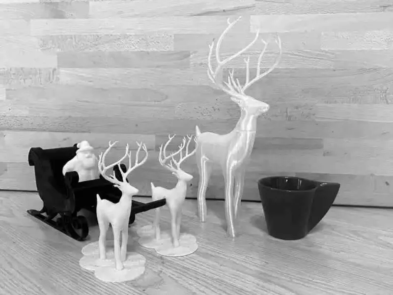 hirsche und Weihnachtsschlitten