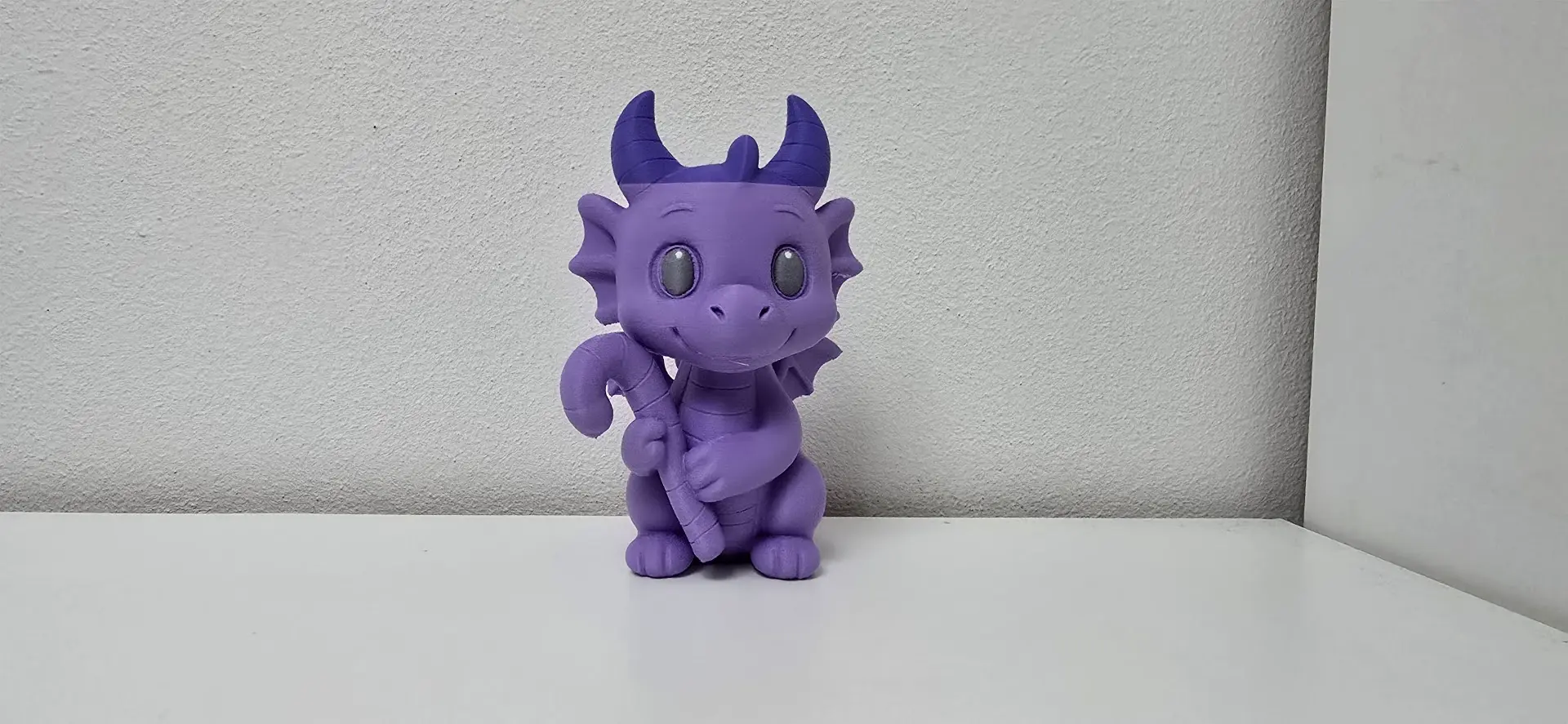 Dragon with Cane and Horns Christmas Figurine