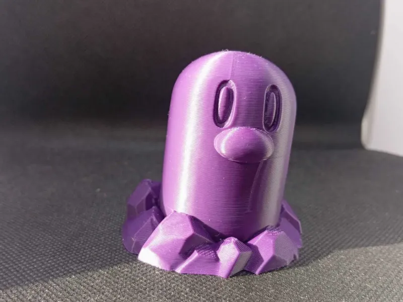 Figura giocattolo di Diglett, personaggio ispirato a Pokémon