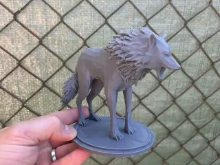 Wolf on a circular pedestal
