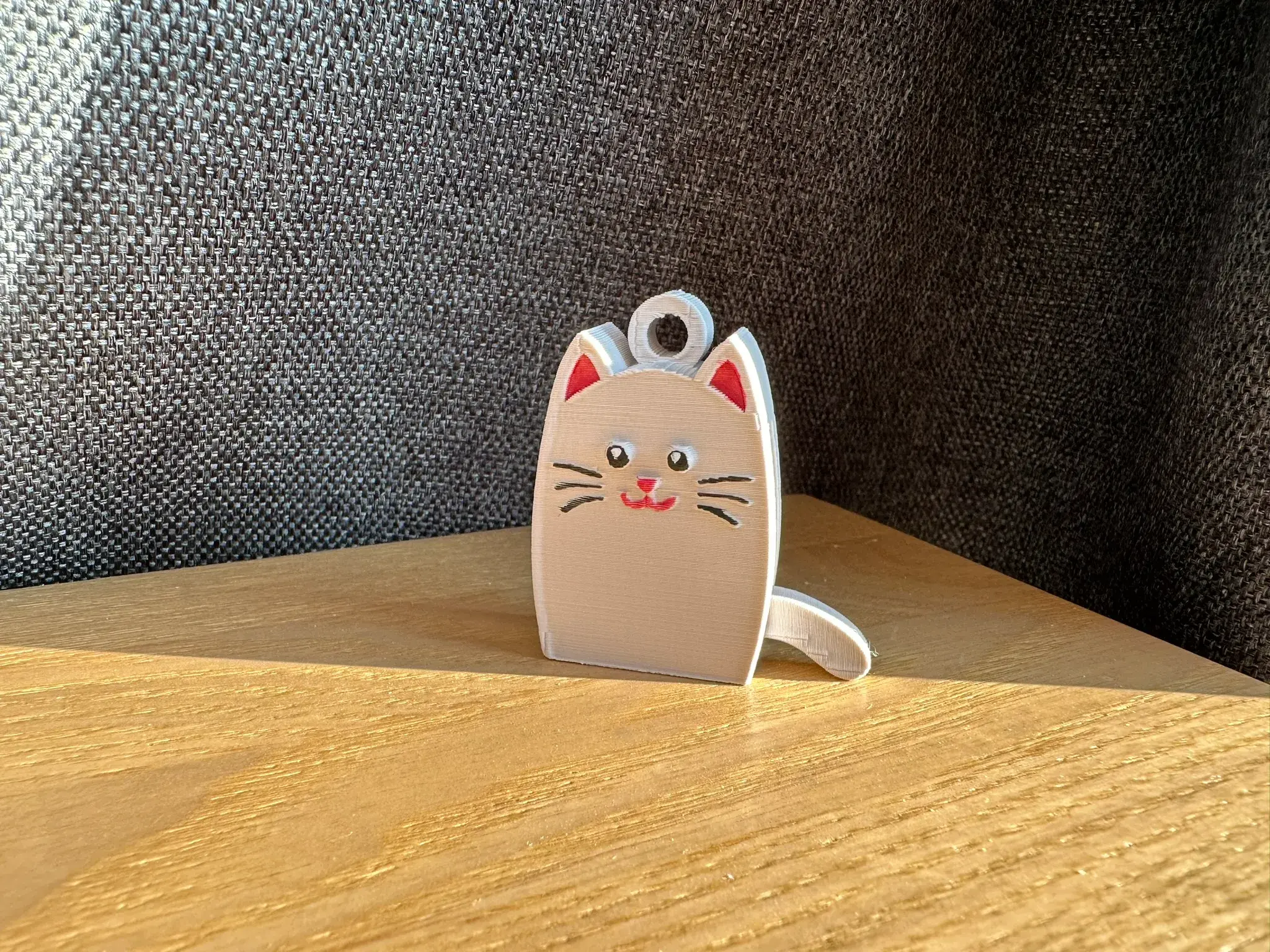 Сat with dangling tail