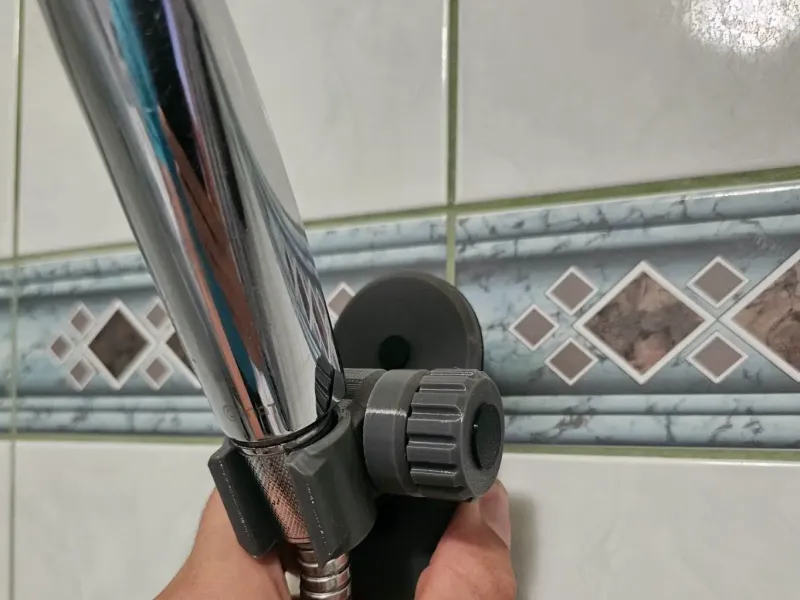 Shower head holder with adjusting wheel