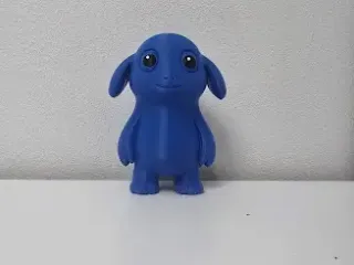 Smiling Blue Monster with Droopy Ears Figure