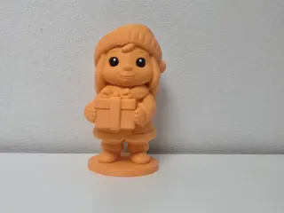 Smiling Child with Gift Box Christmas Figurine