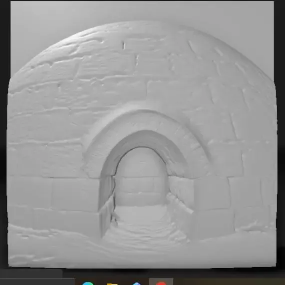igloo made of compacted snow blocks with icy entrance tunnel