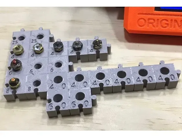 Jigsaw nozzle storage blocks for M6-size 3D print nozzles