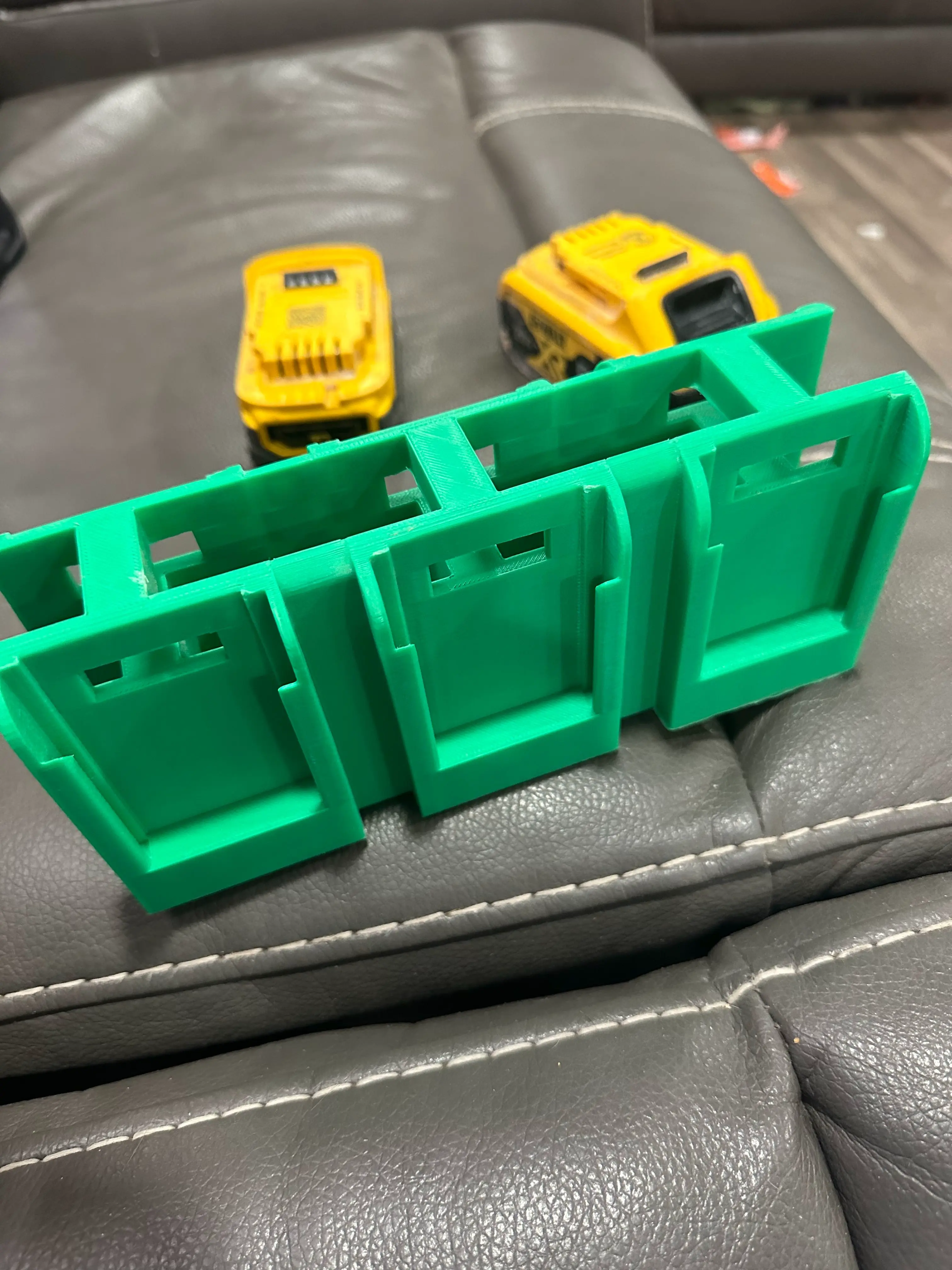 battery holder compatible with Dewalt batteries.
