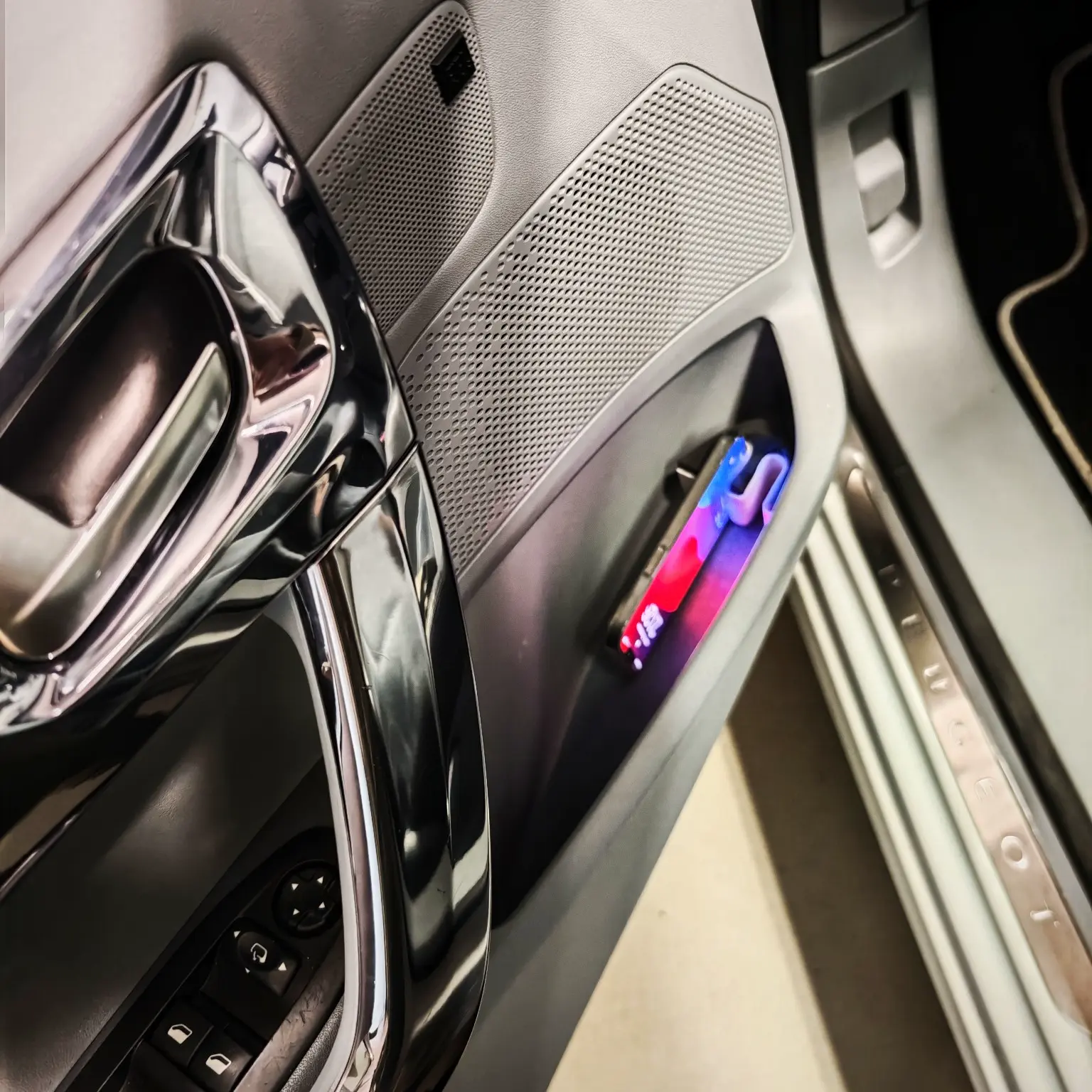 Phone holder to car door pocket