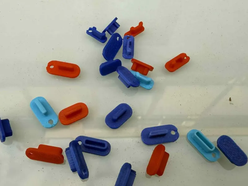 Dust plugs for mobile phones