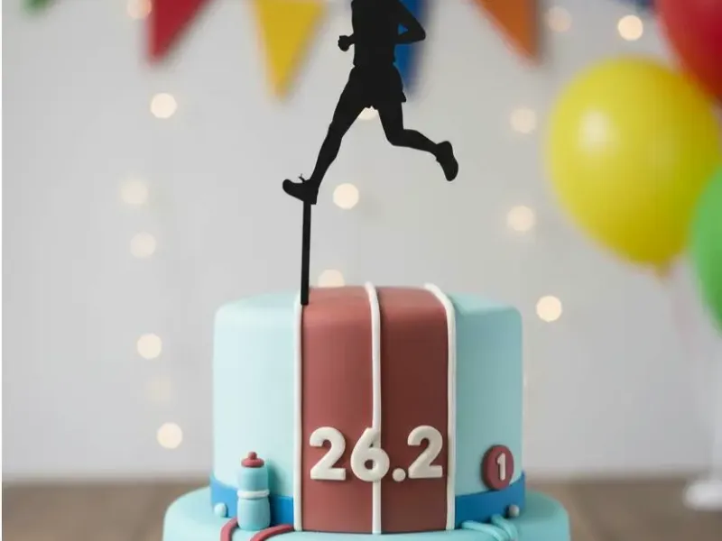A marathon runner cake topper