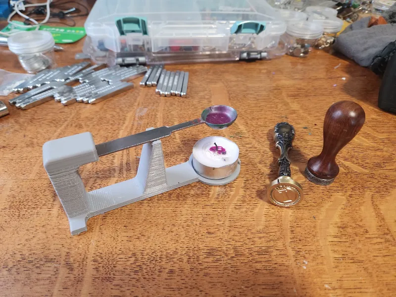 Wax spoon and candle holder