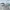 Brick waterfront with large loading and unloading crane for
