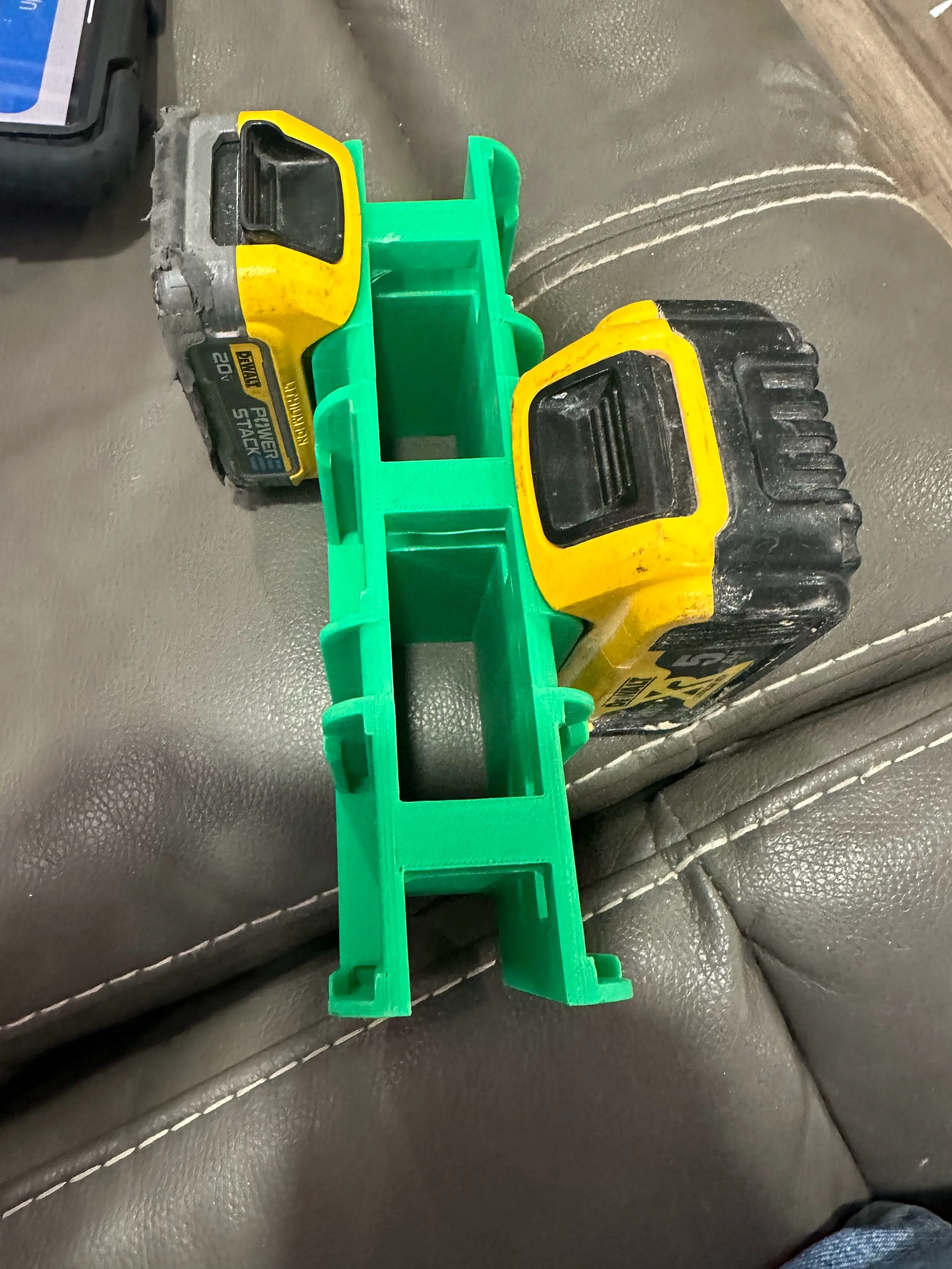 battery holder compatible with Dewalt batteries.