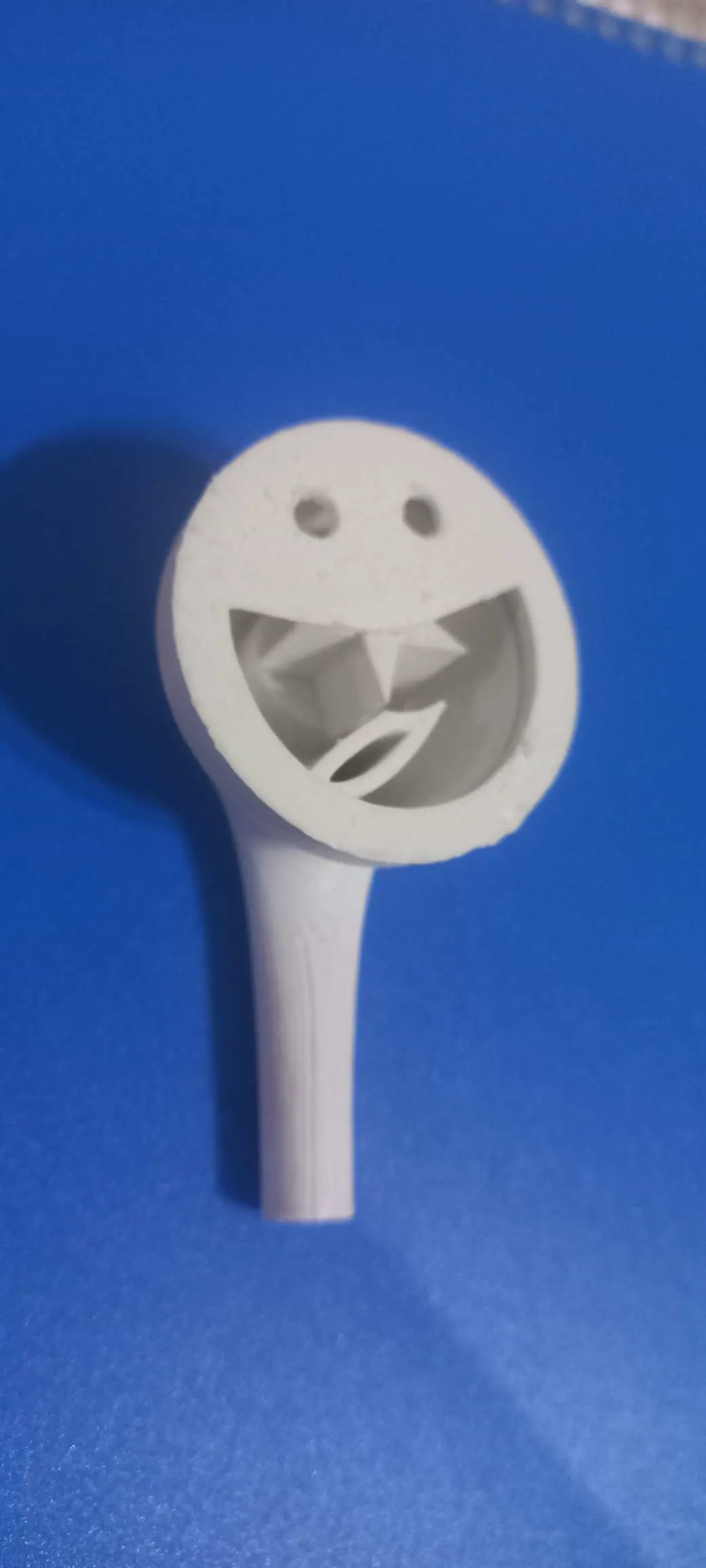 smiley face with teeth whirring when blowing