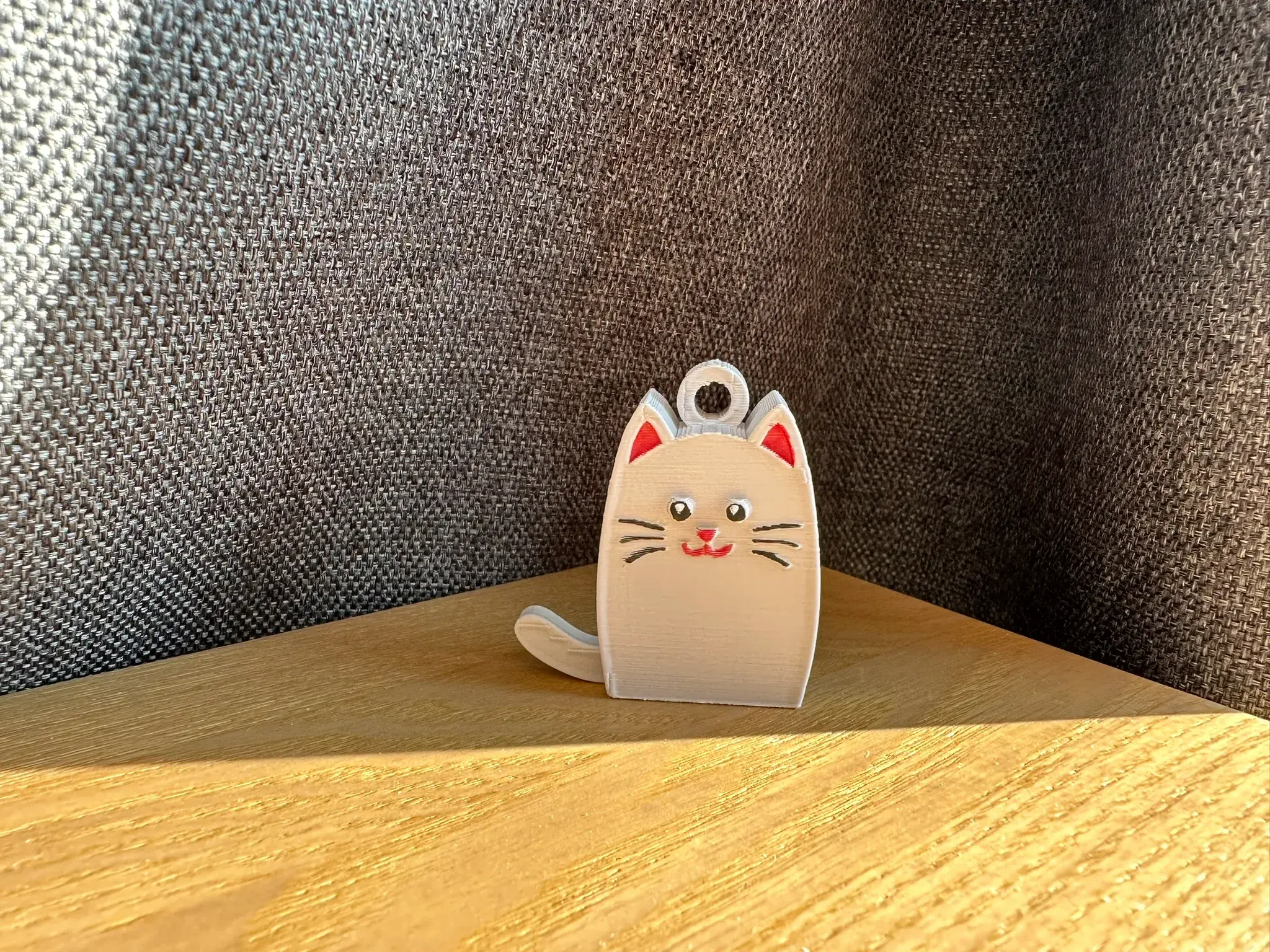 Сat with dangling tail