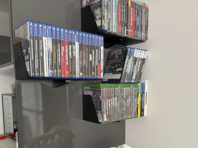 Lightweght console games/DVD/CD holder/shelf.