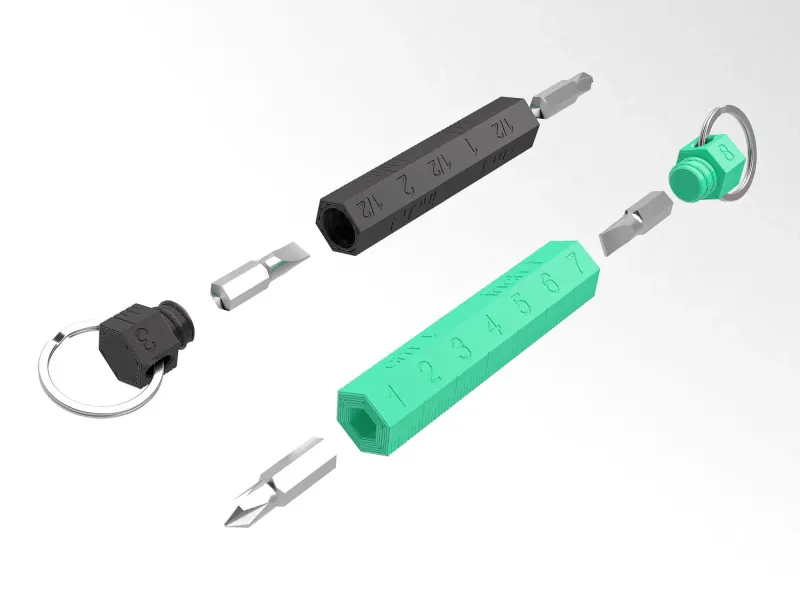 Multi-purpose keychain with screwdriver and integrated rule