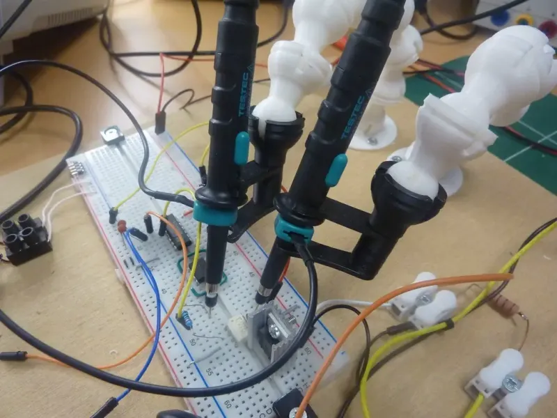 Suporte para ponteira de osciloscópio