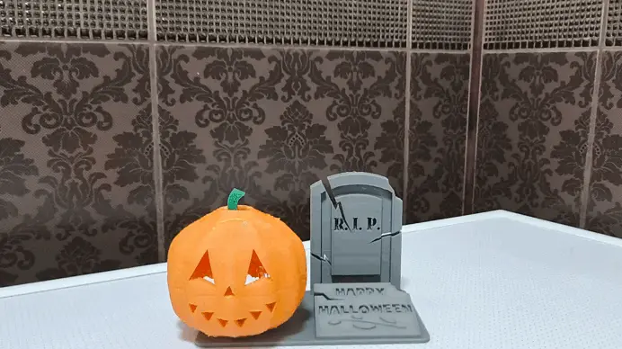 Halloween phone stand with a cool glowing pumpkin.