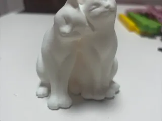 Two nuzzling cats