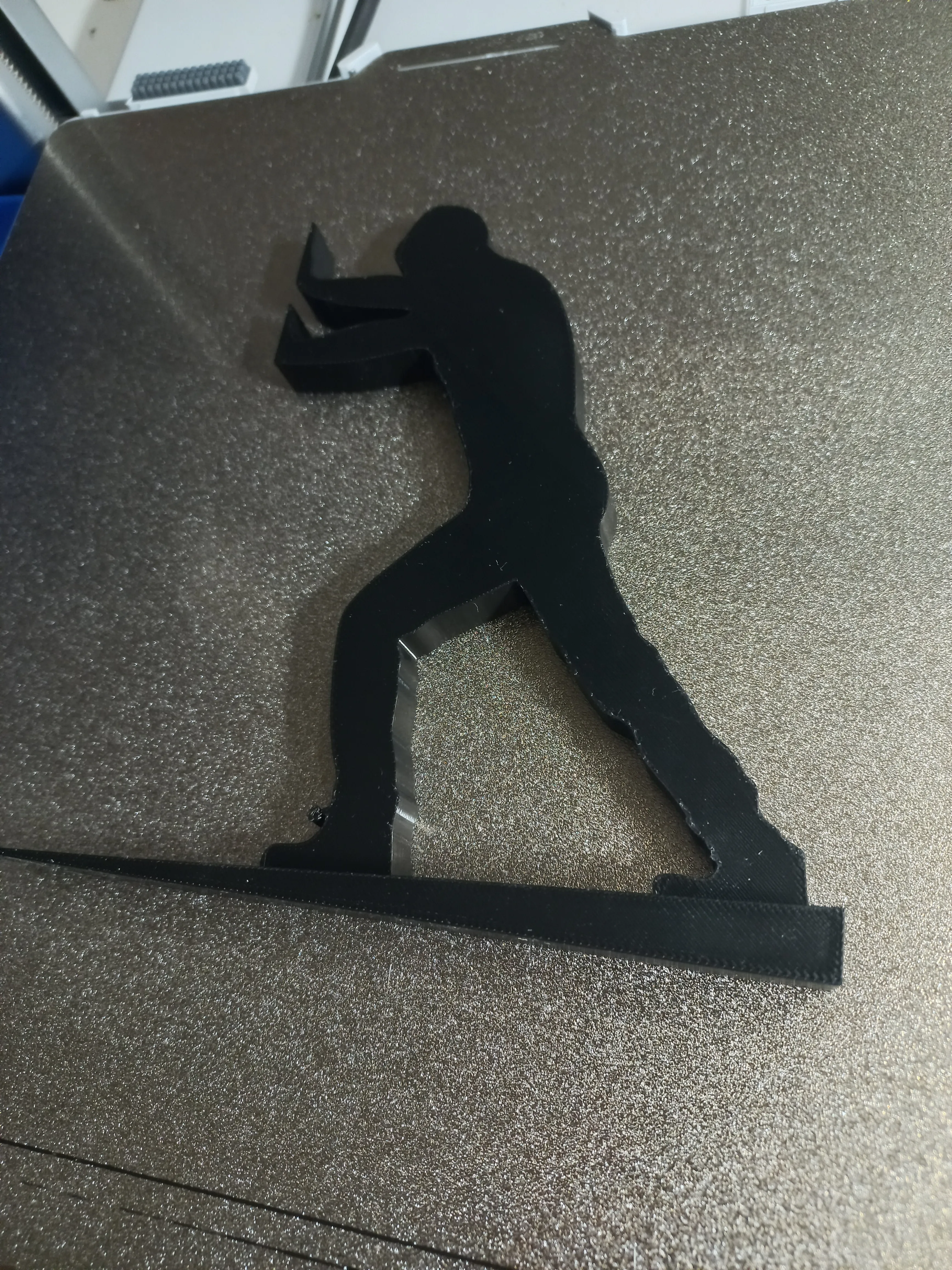 Pushing man book holder / door stop